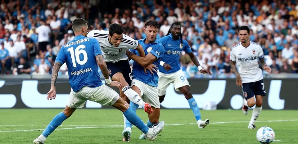 Players competing for the ball in Serie A match