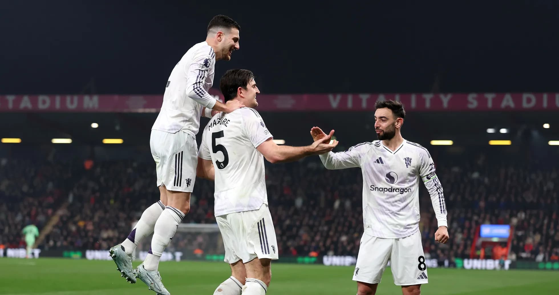 Players celebrating a goal at Vitality Stadium