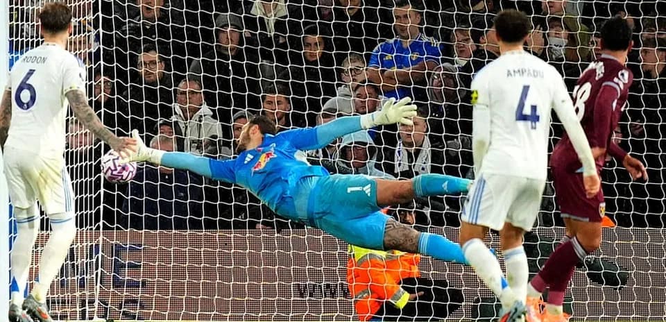 Goalkeeper making a diving save during match