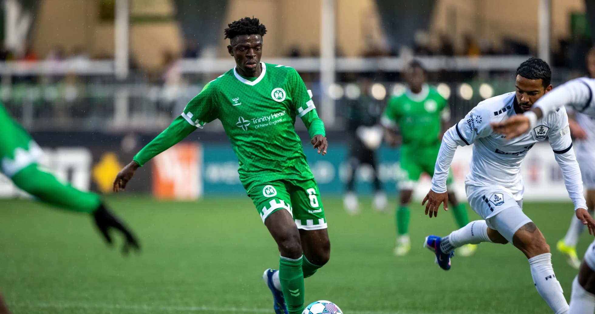 Player dribbling the ball during USL match