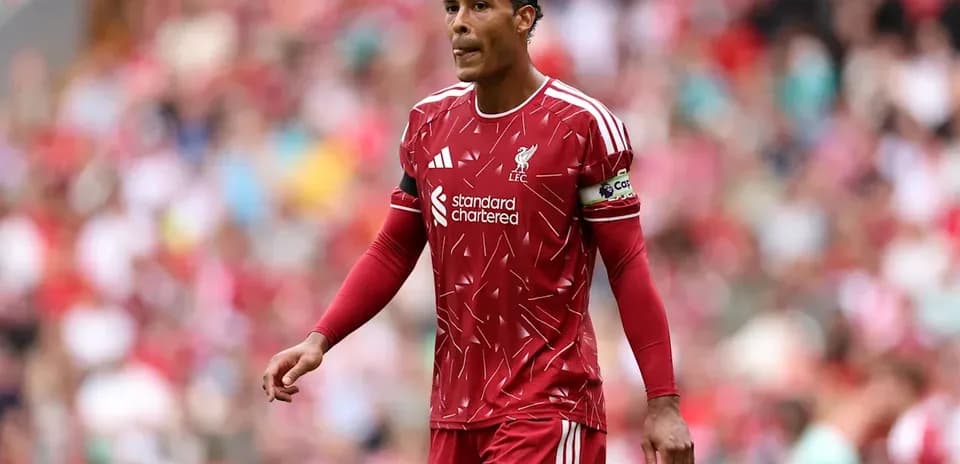 Liverpool player wearing red kit on the pitch