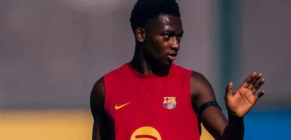 Player in red training kit during practice session