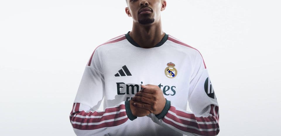 Player wearing Real Madrid jersey posing confidently