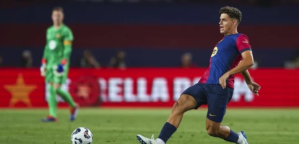 Player kicking ball during football match