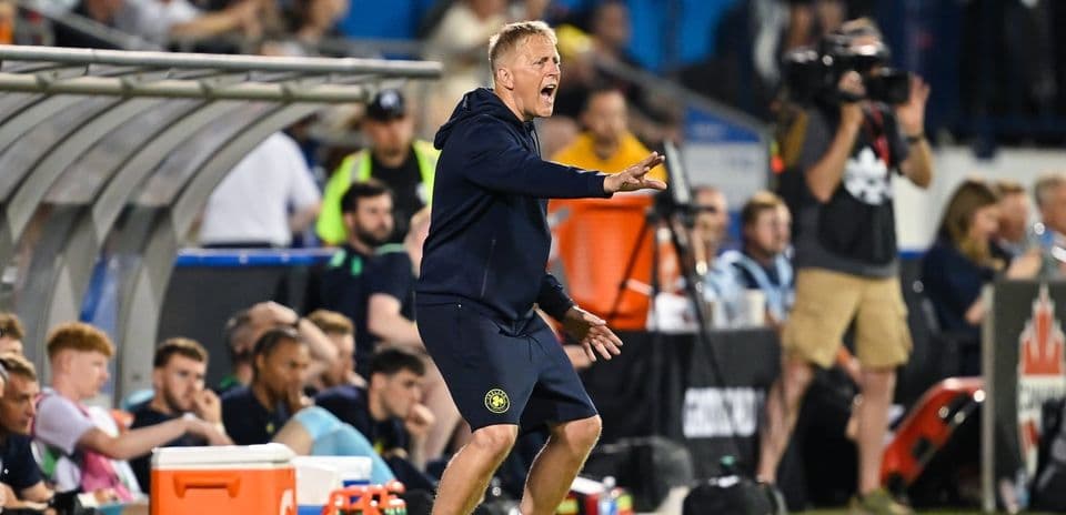 Coach giving instructions from the sidelines during match
