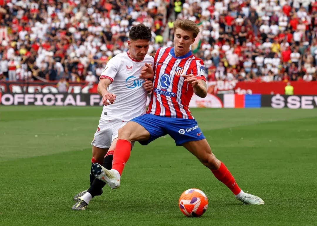 Sevilla and Atletico Madrid players battling for the ball
