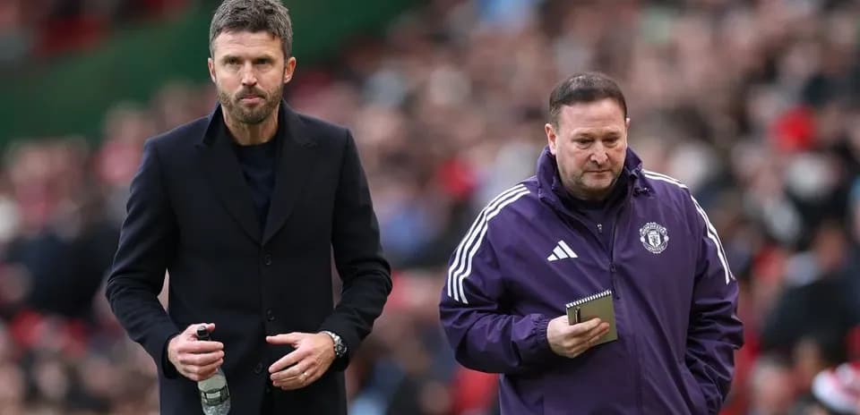 Coaches walking on the pitch during match