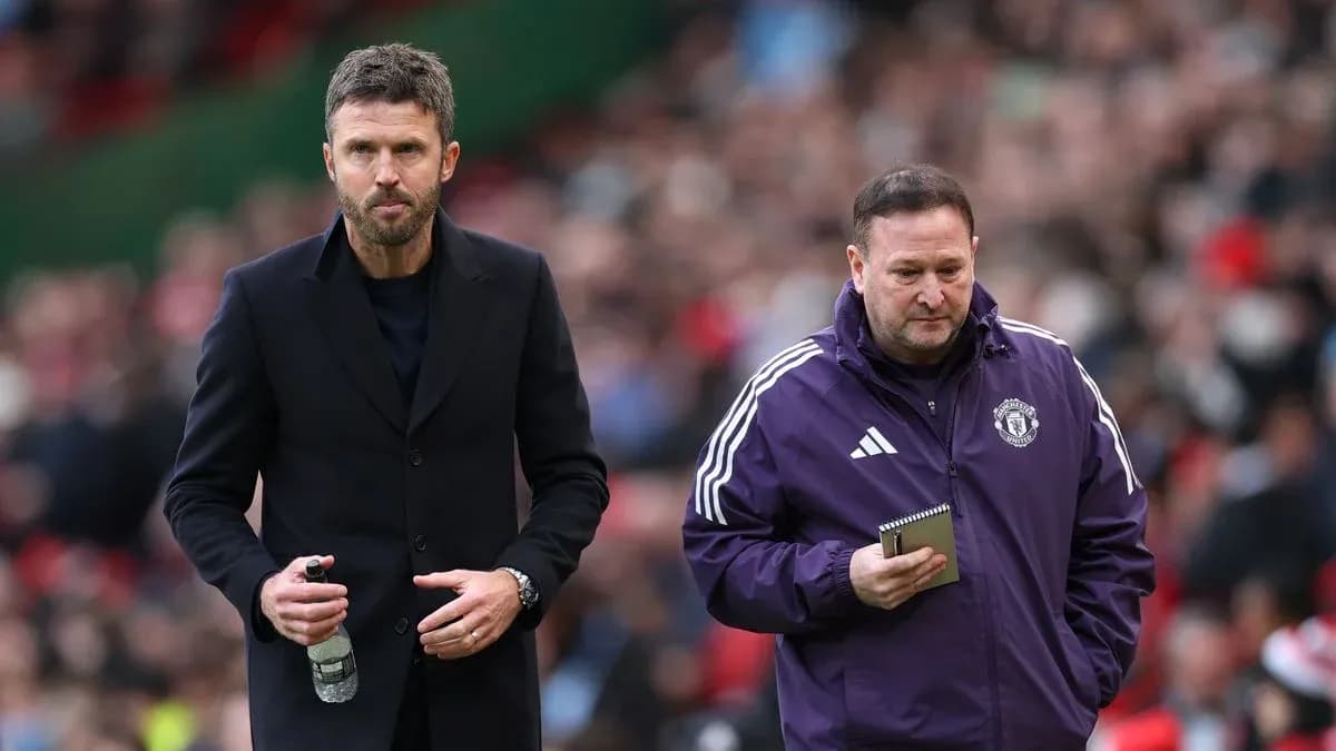 Coaches walking on the pitch during match