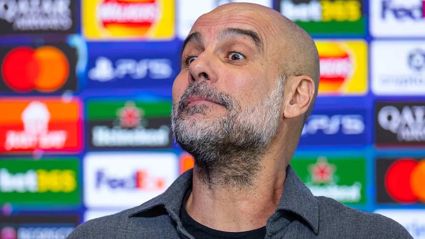 Manager at press conference with sponsor backdrop