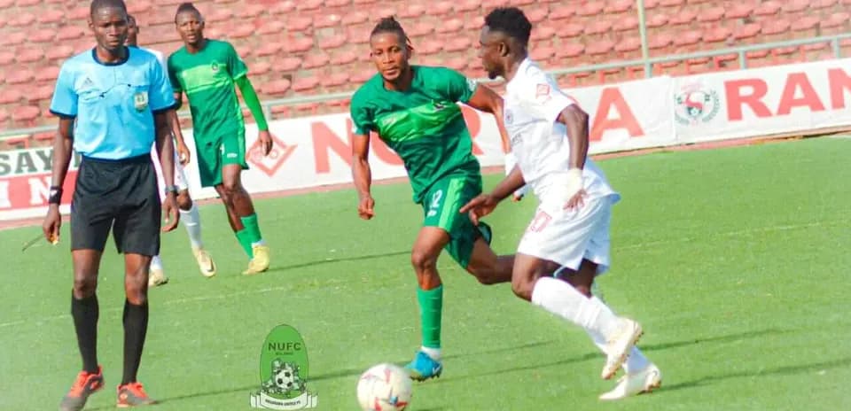 Players contesting for the ball in NPFL match