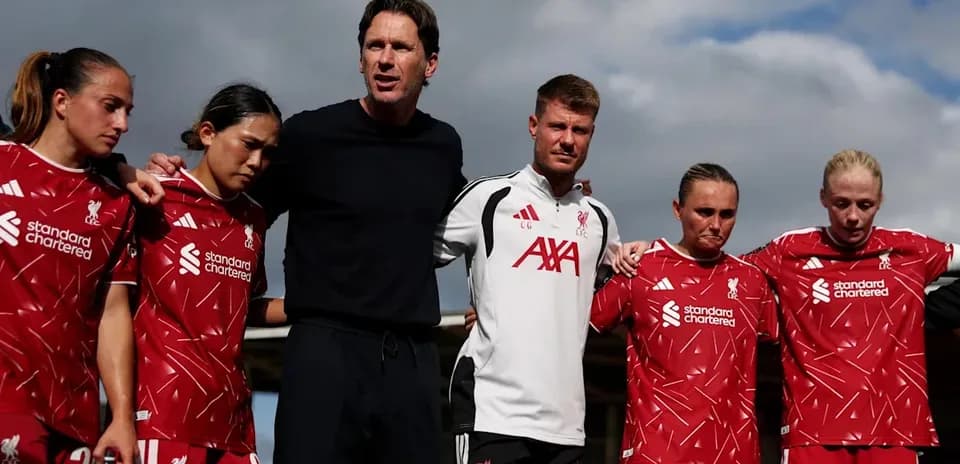 Liverpool women's team in huddle during training session