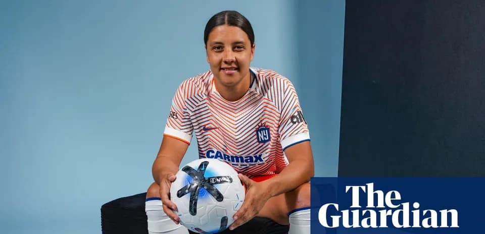 Player posing with a soccer ball in studio