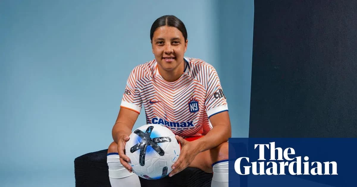 Player posing with a soccer ball in studio