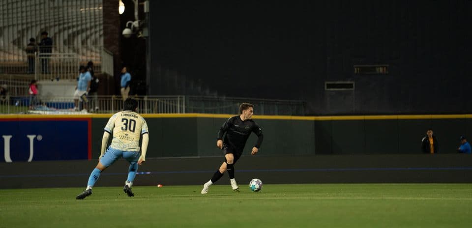 Player dribbling the ball during match