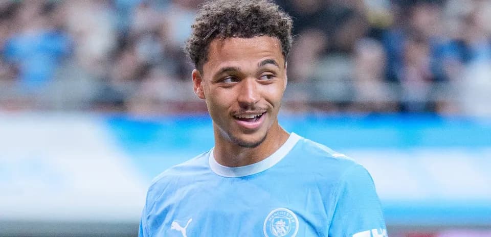 Player smiling during training session in light blue kit