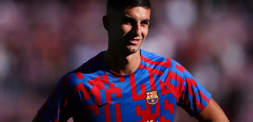 Football player posing in FC Barcelona jersey