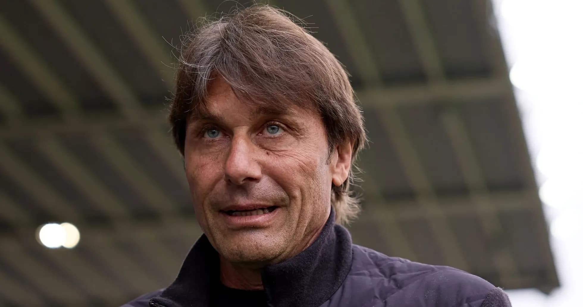 Football manager speaking at a press event