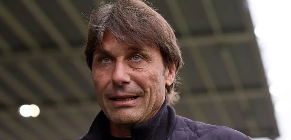 Football manager speaking at a press event