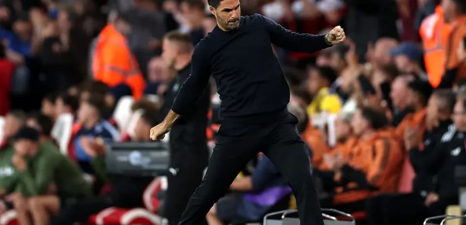 Manager celebrating on the sidelines during match