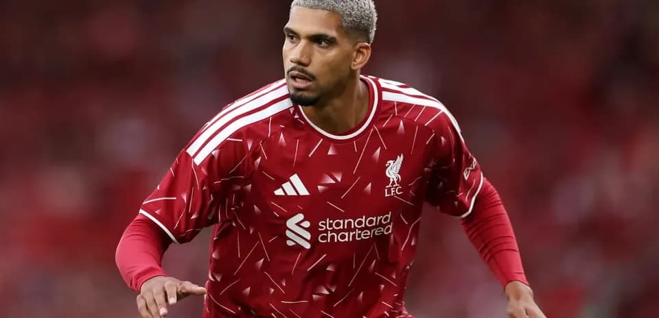 Player in red Liverpool kit during match action