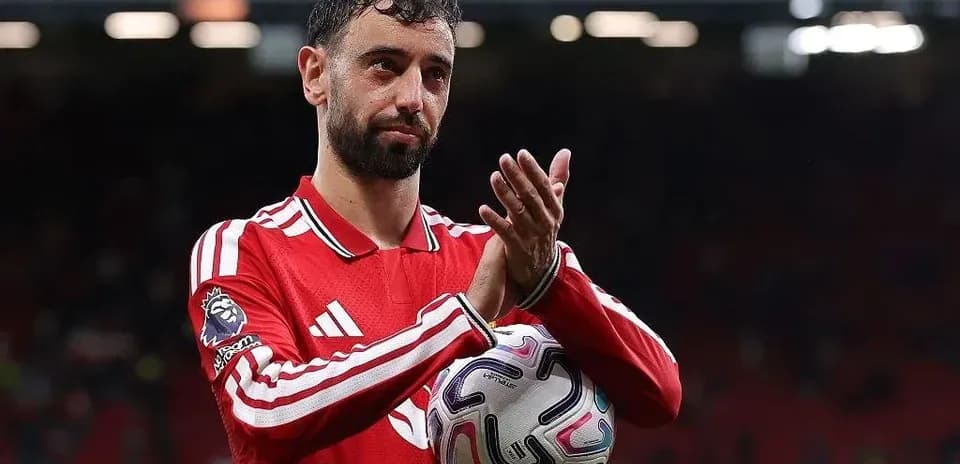 Bruno Fernandes applauding fans after the match
