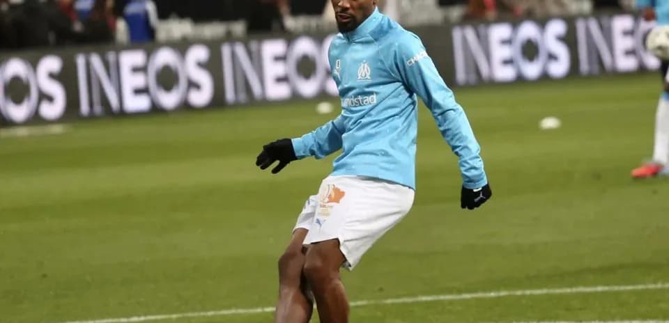 Player warming up on the pitch before match
