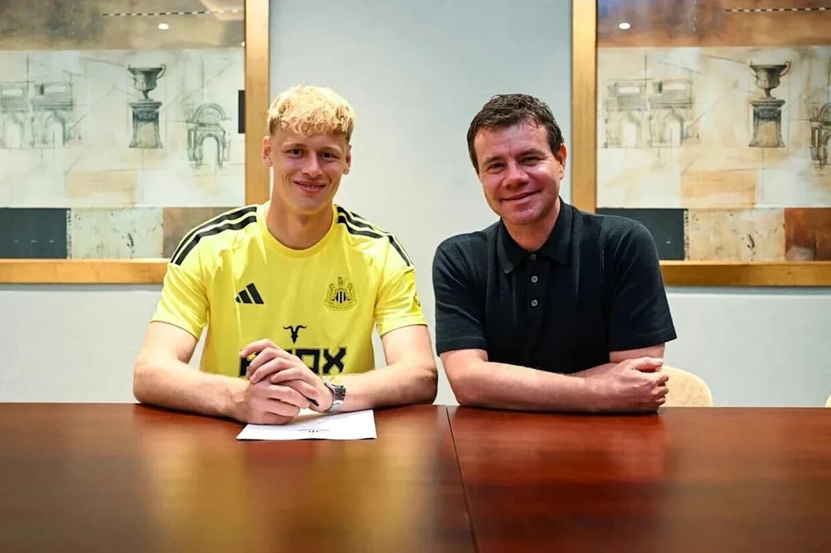 Player signing contract with club representative indoors