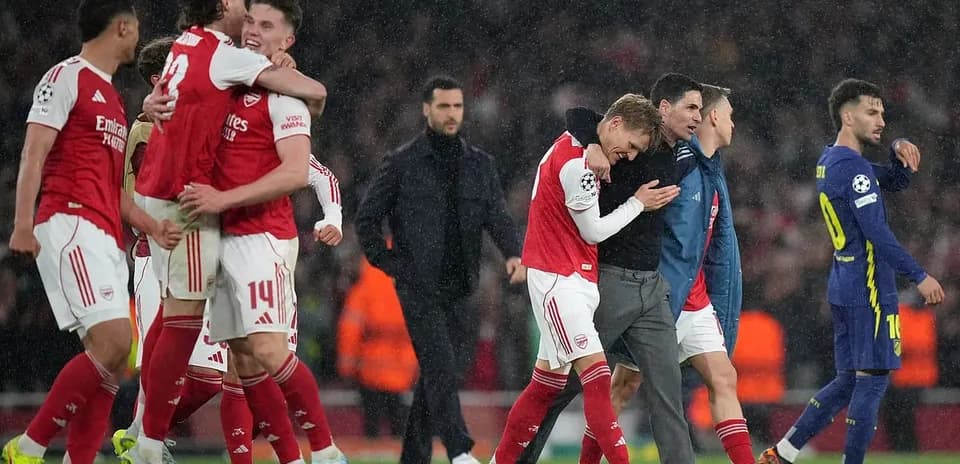 Arsenal players celebrating after UEFA Champions League match