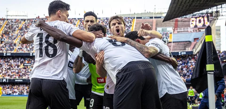Valencia players celebrating a goal together