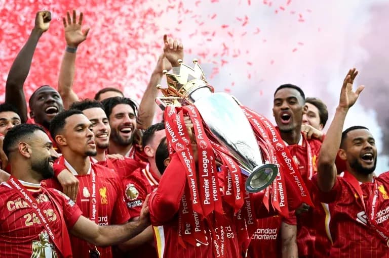 Liverpool players celebrating with Premier League trophy