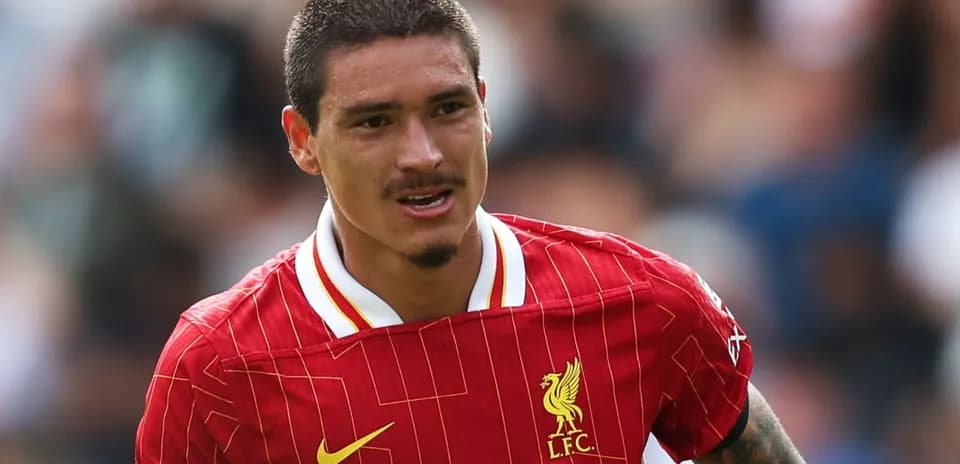 Player in Liverpool jersey running during match