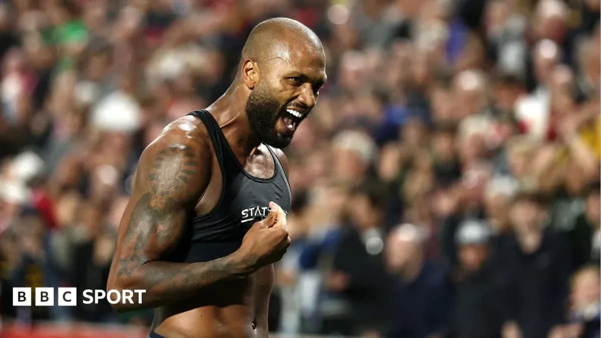 Athlete celebrating passionately in front of crowd