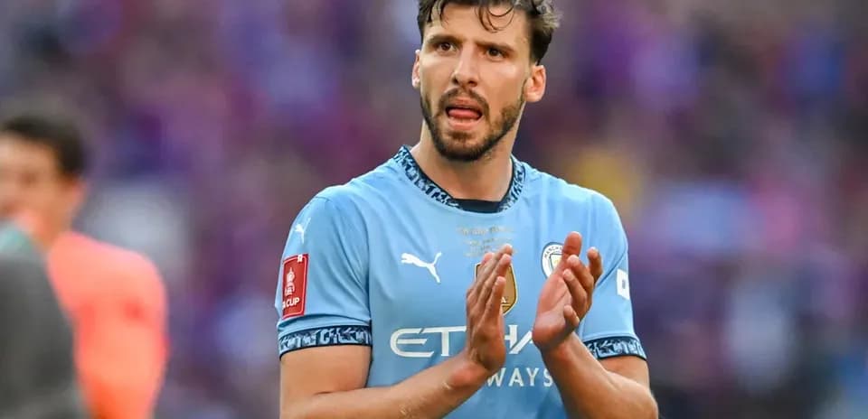 Player applauding fans after match in blue jersey