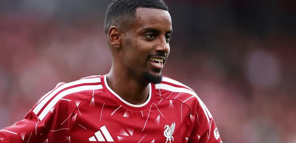 Player smiling while wearing Liverpool FC training kit