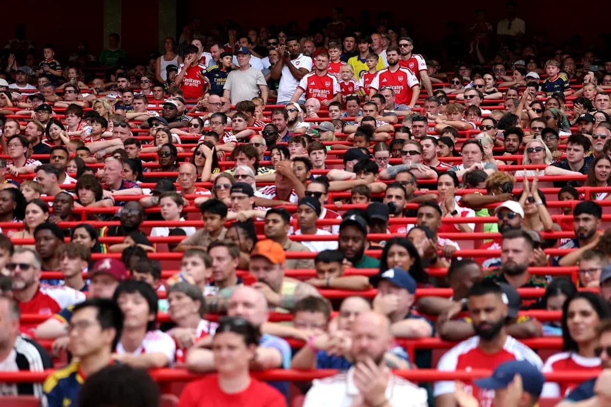 Crowd of Arsenal fans in stadium seating