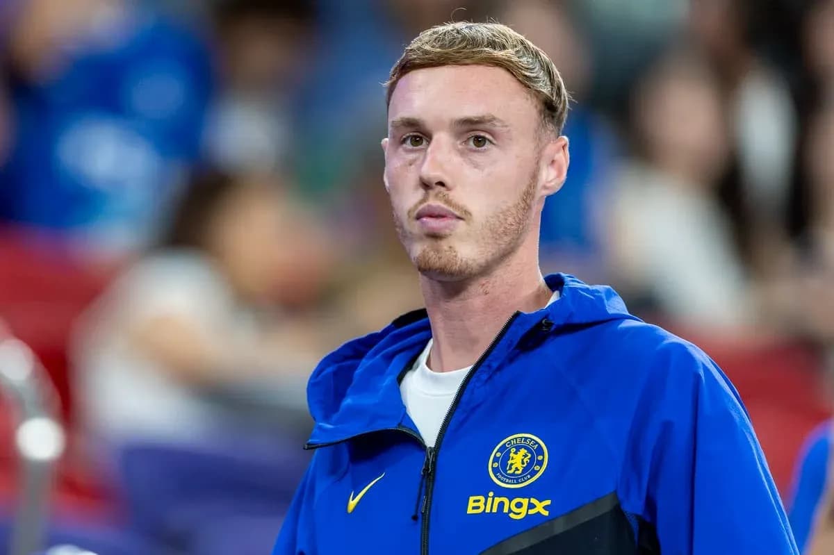 Player in Chelsea FC training jacket on sidelines