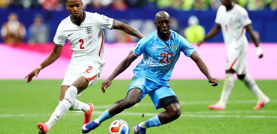 Player from England challenges Congo DR player