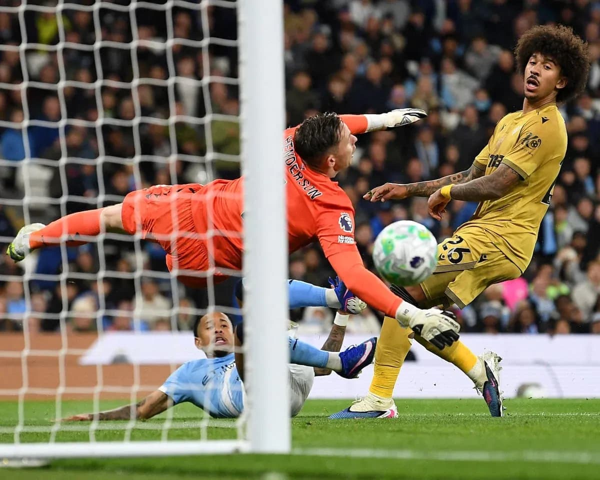 Goalkeeper diving to save shot in match