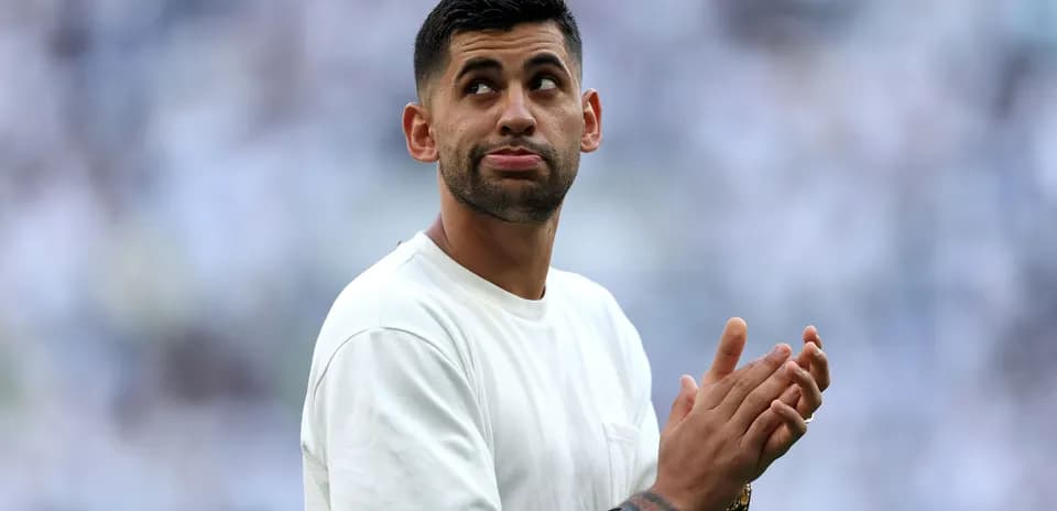 Player clapping in a stadium before a match