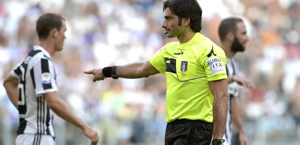 Referee giving instructions during match with players