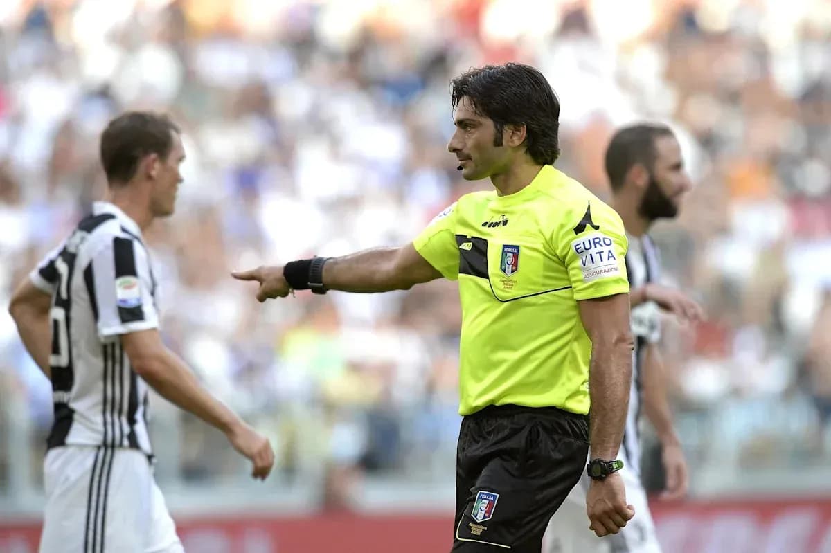 Referee giving instructions during match with players