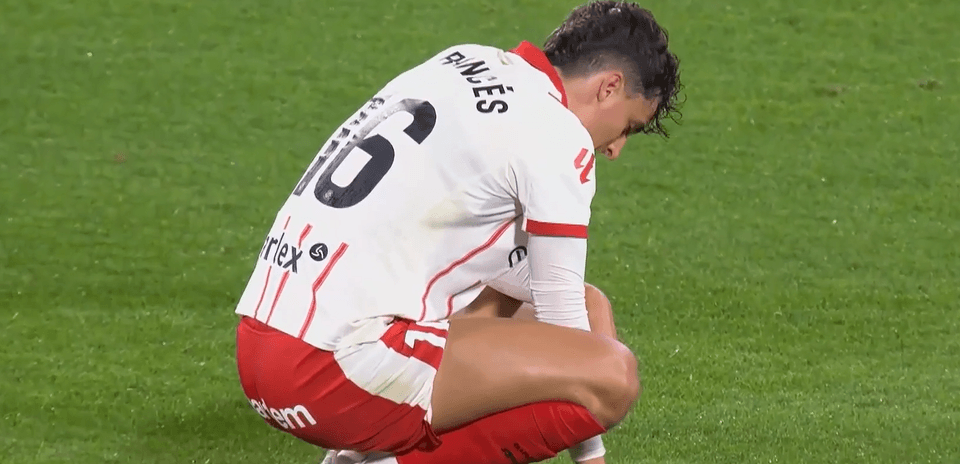 Player crouching on the pitch during match