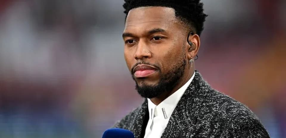Sports commentator speaking into microphone on set