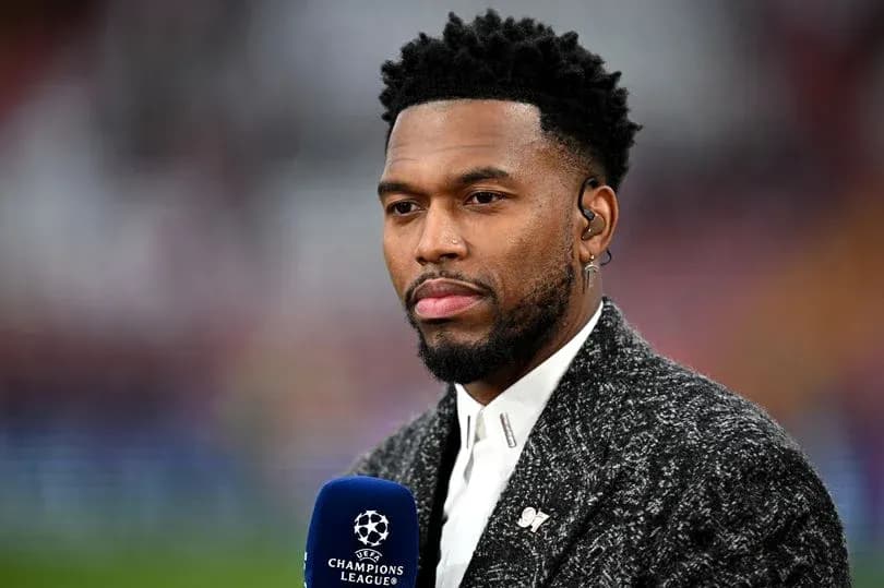 Sports commentator speaking into microphone on set