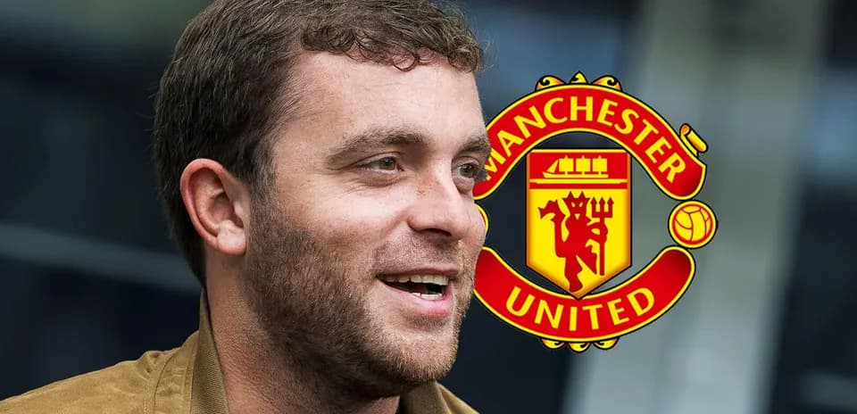 Man speaking with Manchester United logo in background