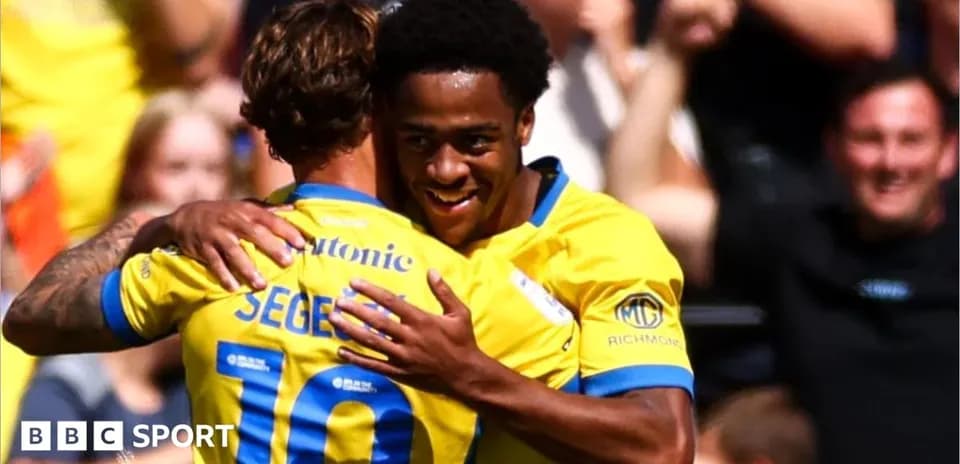 Players celebrating a goal during a match