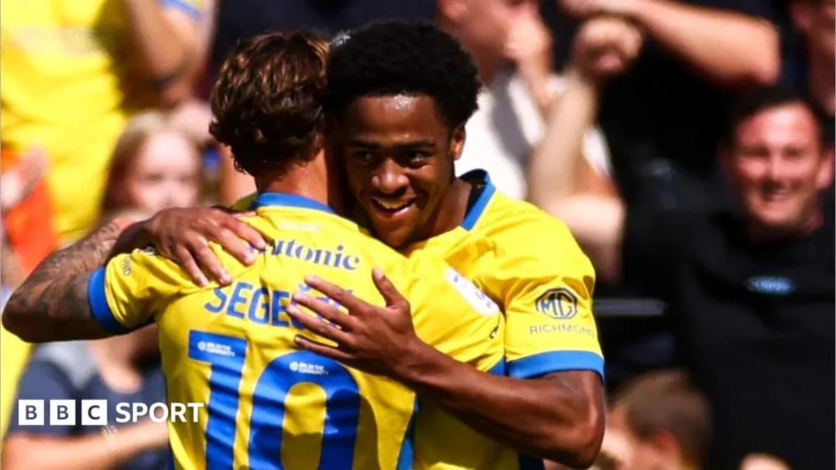 Players celebrating a goal during a match