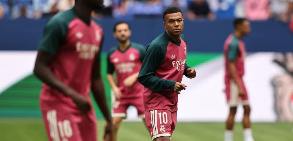 Players warming up before match in training kits