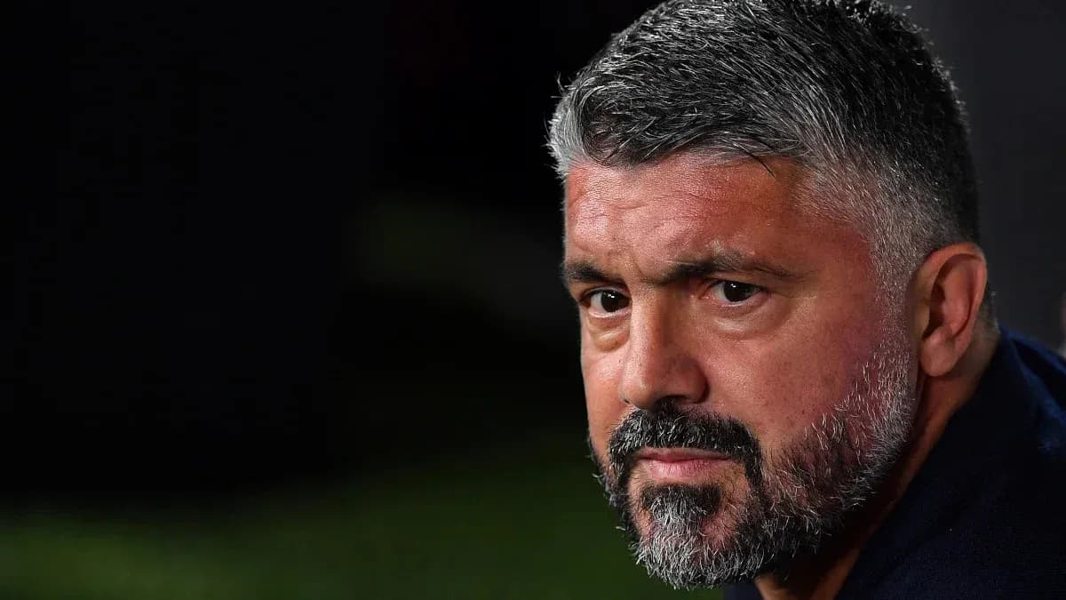 Coach looking intently during match on sidelines