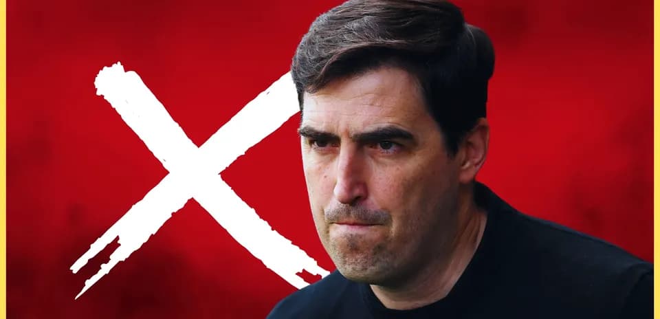 Coach with serious expression against red background